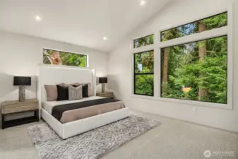 Designer primary suite with five-piece bath with heated floors