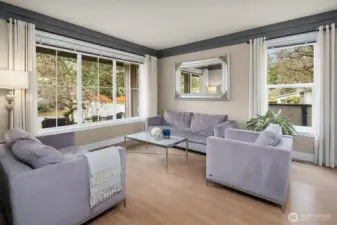 An OPEN + BRIGHT Living & Dining Room welcome your guests in style.