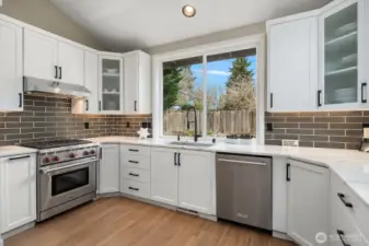 Wolf & KitchenAid appliances+beverage cooler and microwave drawer.