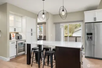 Wolf & KitchenAid appliances+beverage cooler and microwave drawer.