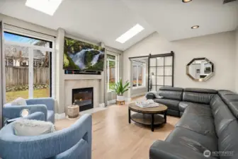 A Striking metal-and-glass door opens to the huge Home Office / Bonus Room