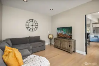 A huge home office / bonus room with a striking metal-and-glass door