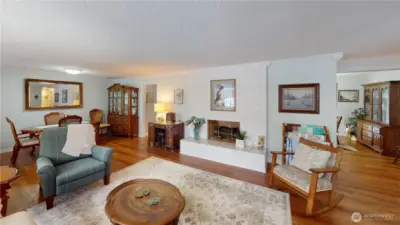 Through the left doorway is the kitchen, laundry room, and garage, to the right is the informal dining area and access to backyard.