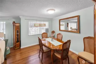 Your dining area is large and can accomodate a much larger table than the one pictured here.