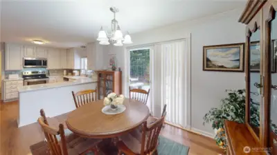 The slider leads to your sweet backyard, great for outdoor dining, yardening, relaxing.  Ahhh.  Let's head out back.