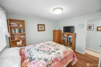 Bedroom number two features the same flooring found throughout the home (except for the bathrooms.)  Continuity in flooring is a must when maintaining a feeling of flow throughout a home.