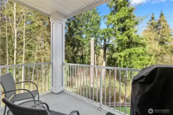 Private deck overlooking serene greenbelt views