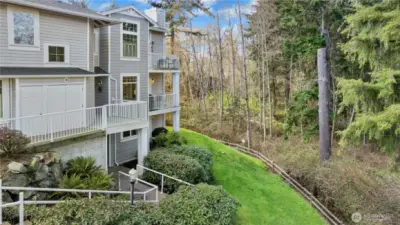 Surrounded by lush greenery and thoughtfully landscaped grounds