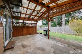 Enjoy outdoor living in any season on the covered back patio, perfect for relaxing evenings and gatherings.