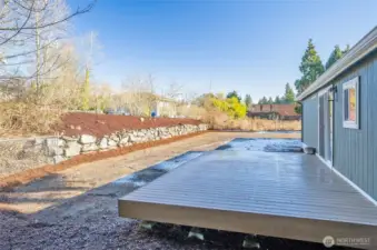 A beautifully terraced backyard with ample space for recreation and relaxation. Back yard was newly seeded for a lush lawn in the Spring