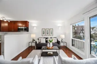 Relax in the open living space with glass sliding doors and a wall of windows.