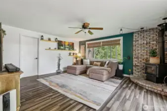 Living room w/ cozy wood burning fireplace