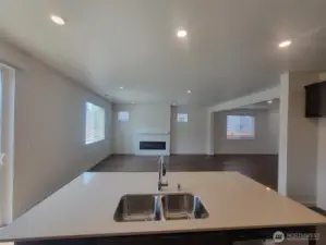 Kitchen overlooking great room and dining space