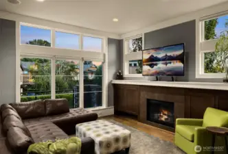 Gas fireplace and floor to ceiling windows
