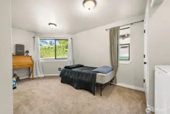 Flex space can be utilized as a den/office/hobby room/guest room/gym