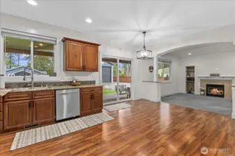 View of patio exit and family room from kitchen