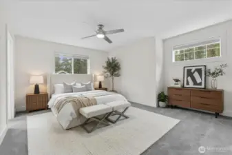 Primary bedroom. Primary bath located on left. Virtually staged. Window coverings convey