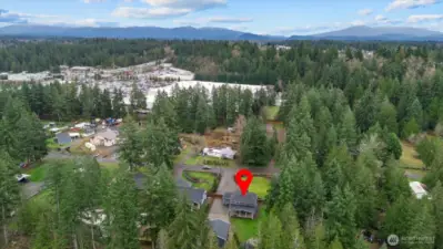 Drone image looking east from back of property. 410 is shown in the top left