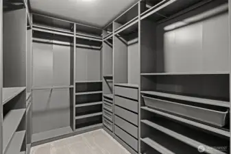 Incredible built-in custom closets in Primary Walk-in Closet