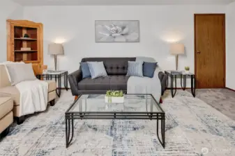 Living room with door to walk-in closet.