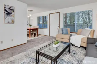 Open flow from living room to dining area and kitchen.