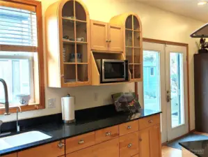 Beautiful maple cabinets with soft close drawers and nook for microwave.