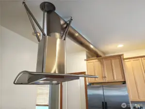 Custom designed stainless steel range hood.