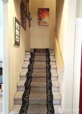 Stairs leading to the bedrooms and media room.