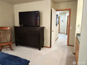 Primary bedroom looking up the corridor to the other bedrooms.