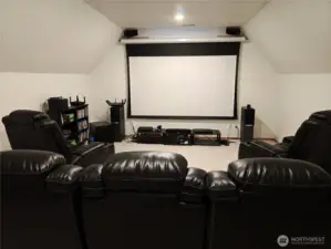 Bonus room now used for a media/screening room. Perfect for your hobby room or home office or just a nice place to relax. Located at the top of the stairs.