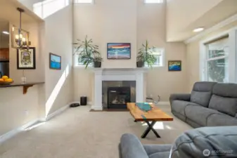 High ceiling with lots of light in this grand living room.