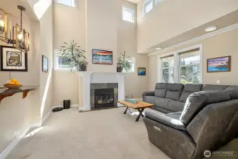 Plenty of room for people to gather around the cozy fireplace.