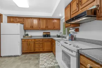 Really Nice Honey Oak Kitchen Cabinets with Corian Counters. Appliances Included in Sale