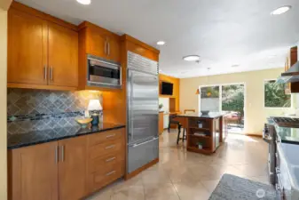 South facing, sunny kitchen opens onto large back deck.