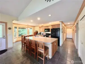 Spacious and Stylish Kitchen, Designed with   Entertaining in Mind. Ample Counter Space   Provides the Perfect Setup for Hosting   Friends, Whether It’s Game Day or a Casual   Gathering. The Kitchen Features a Bar   Captain's Cabinet, Beautifully Crafted   Cabinets, and an Open Layout that Creates a   Welcoming Atmosphere for All