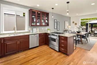 Serve up a home-cooked meal or your favorite takeout—this kitchen connects beautifully to the dining area and outdoor living beyond.