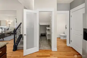 Just off the kitchen, you’ll find a spacious walk-in pantry, main floor powder room, and handy access to the three-car garage.