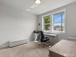 Immediately to your right is the 1st bedroom, perfect for a home office.