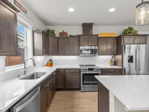 High end appliances (Bosch fridge, BEKO microwave and range) complete the space.