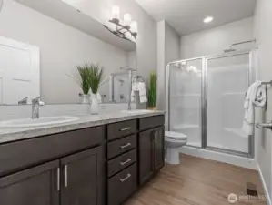 There's plenty of room to get ready for the day in the ensuite 3/4 bathroom with walk in shower.