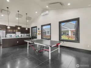 There's even a ping pong table that can be moved in and out. If you're cooking a giant feast and need more kitchen space, there's a full kitchen here too.