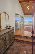 The covered entryway transports you from the busy world to your private waterfront oasis. Imagine this view welcoming you home every day.