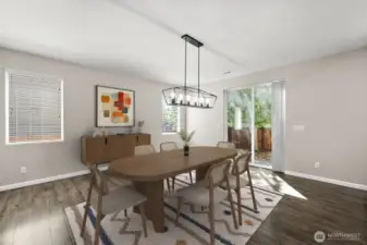 **Virtually Staged** Effortless host summer BBQs with backyard entrance right off dining room space. Natural light from mutliple directions and modern chandelier light fixture.