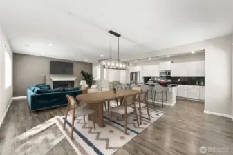**Partially virtually staged** Open concept perfect for entertaining - dining room flows into kitchen and cozy living room.