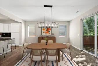 **Virtually Staged** Dining spot leads out to backyard through large sliding glass door.