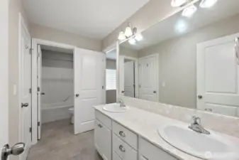 Jack and Jill bathroom vanity looking out to bedroom and hallway