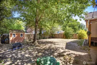 Large lot, fully fenced backyard with storage shed