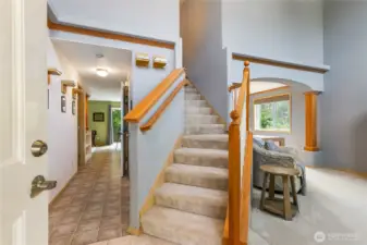 You are greet by a lovely staircase. Formal living/dining to right.