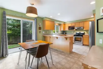 Kitchen with eating space & slider leading to fully fenced backyard