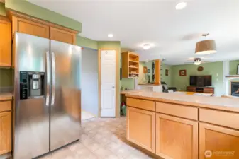 Looking back to dining/family room with walk-in pantry straight ahead